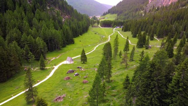 Popular valley of Langental or Vallunga in Dolomites, Selva, Italy. Summer view of Vallunga valley with turists doing outdoor activities.