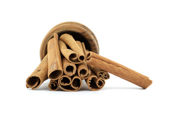 Aromatic cinnamon sticks in wooden bowl isolated on white background