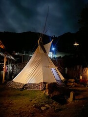 traditional ceremonial teepee in night mountains