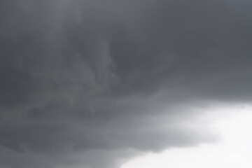 Dark rain clouds are forming in the sky. A storm is coming. Overcast nature background.