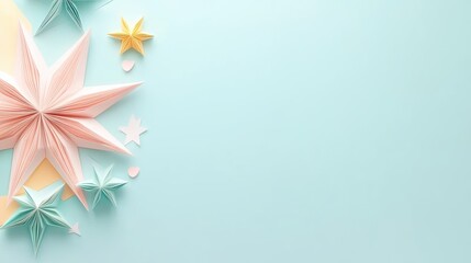 Obraz premium Colorful paper stars on a soft blue background, perfect for creative projects.