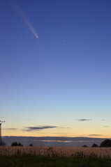 night sky with a comet, beautiful background of a comet flying over the landscape, comet C2023 A3 Tsuchinshan ATLAS relax astrology background