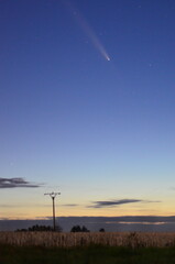 night sky with a comet, beautiful background of a comet flying over the landscape, comet C2023 A3 Tsuchinshan ATLAS relax astrology background