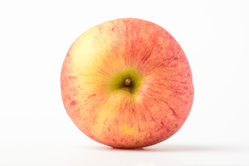 Fresh ripe apple with tiny water drops on white background