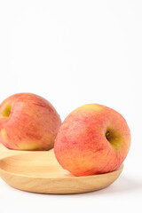 Fresh ripe apple with tiny water drops on white background