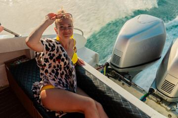 Young woman at the yacht's engine