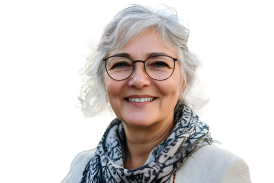 Smiling portrait of senior woman looking at camera outdoor. Head shot of 60 year old woman over urban background.
