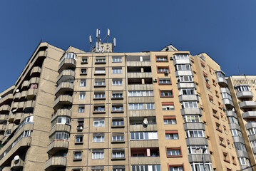 Fototapeta premium Typical facade of concrete panel building. Post Soviet flat of blocks
