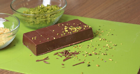 Dubai chocolate with pistachio paste and kataifi dough. Confectionery food and sweets with your own hands at home in the kitchen.