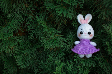 Cute handmade toys cute rabbits crocheted in nature in autumn