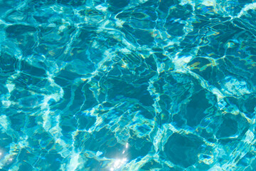 Pool water background, blue wave abstract or rippled water texture background.