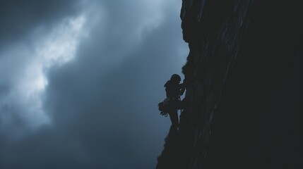 Dramatic Climber Against Cloudy Sky Background