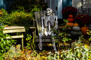 Halloween skeleton decorations. Halloween skeleton for decorated house. Scary skeleton Decorated at front yard of a American home. Trick or treat. Halloween skeleton background.