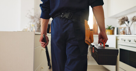 Back, plumber and tools in kitchen for maintenance, service and professional help for leak. Man,...