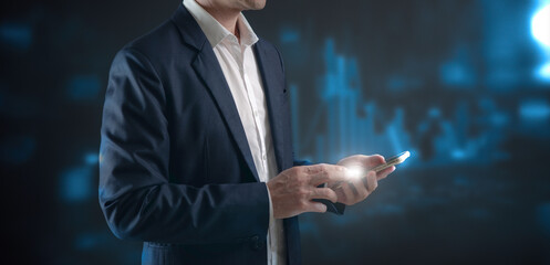 investment and finance concept, businessman touching virtual trading graph and blurred light on hand, stock market, profits and business growth.