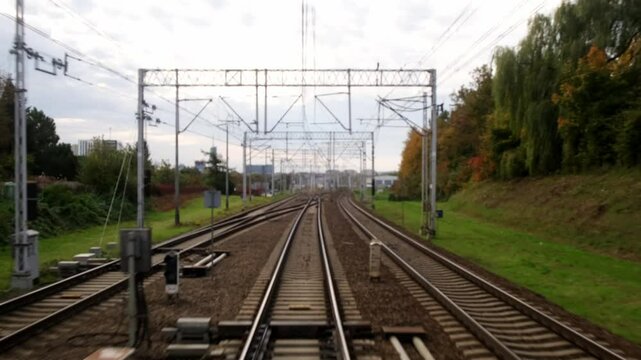 A close-up of the tracks captured while the train is in motion creates a dynamic sense of speed and travel. This shot conveys the energy of the journey and opens up new horizons.