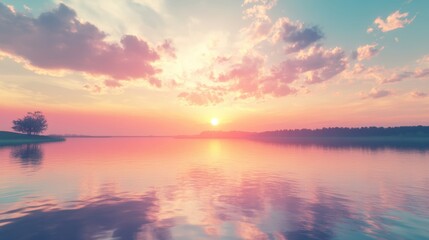 Sunset over calm water with trees.