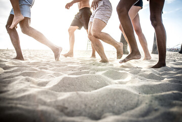 Group of friends making big party and games on the beach in Santa Monica, California during the summer break.