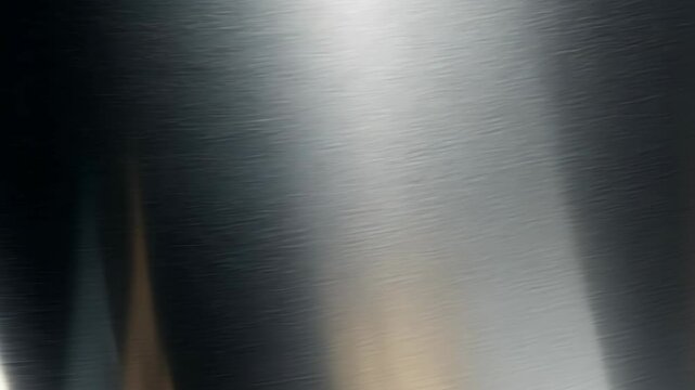 A close-up of brushed stainless steel, showing the subtle texture and metallic sheen