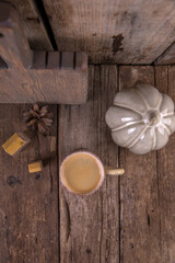 Small cup of espresso on a wooden table