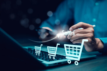 Businessman hold smartphone with online shopping concept, marketplace website with virtual interface of online Shopping cart part of the network, Online shopping business with selecting shopping cart.