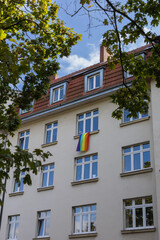 Obraz premium pride flag hanging in the window of the house