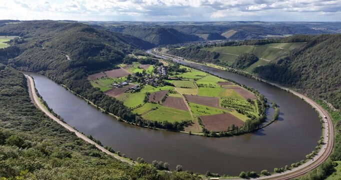Valley at Hamm, small village in the German Saar trier region with the Saar river running through. Aerial drone view.