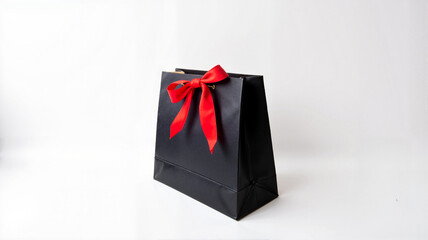 Black Gift Bag with Red Ribbon Bow on White Background