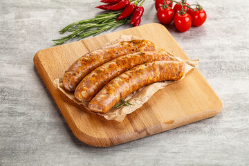 Raw sausages with spices and herbs
