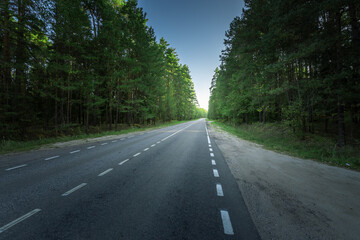 A road with a forest in the background