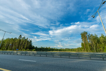 A highway with a clear blue sky above it