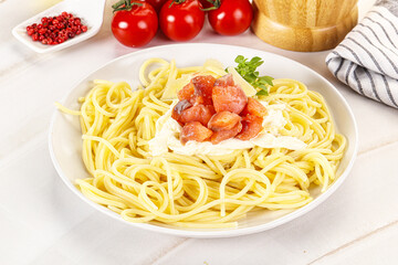 Pasta spaghetti with salmon and stracciatella