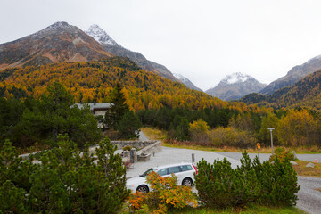 Scenic landscape in the Swiss Alps at Engadin Valley at Swiss mountain village of Maloja with mountain peaks on a cloudy autumn day. Photo taken October 14th, 2024, Maloja, Switzerland.