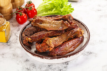 Roasted duck wings with sauce