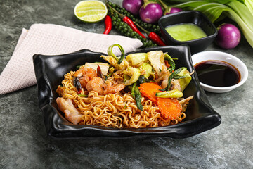 Asian cuisine - Fried noodles with seafood