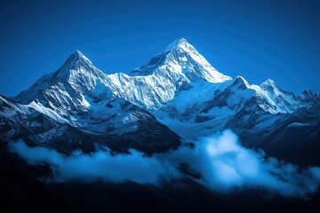 The mountains are covered in snow and the sky is blue