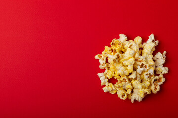 Salty popcorn on bright color background. Cinema and entertainment concept. Movie night with popcorn. Delicious appetizer, snack.Space for text, copy space. Banner