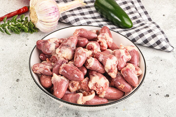 Fresh raw chicken hearts in the bowl