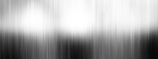 A blurred monochrome image with vertical lines creating an abstract effect.