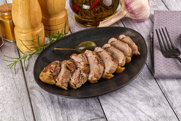 Roasted duck breast slices in the plate