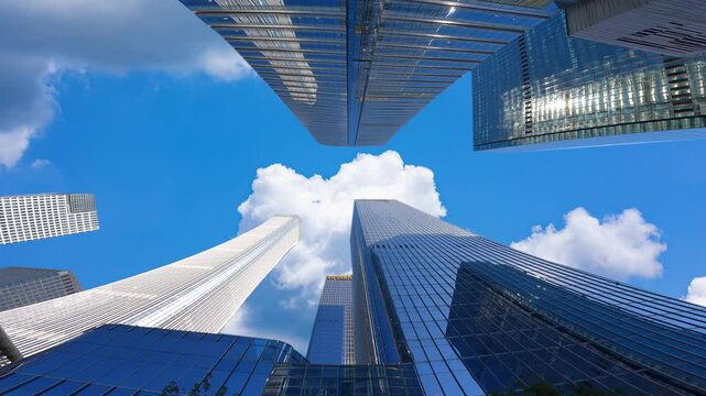 Looking up at the high-rise buildings in the city, the development of Chinese cities，High rise urban buildings, modern high-end office buildings, and commercial office buildings in Beijing, China