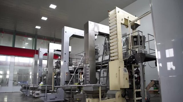 food cake factory on an assembly line, automated Cookies on a Conveyor Belt Production Line in a Factory, ready for packaging and distribution.