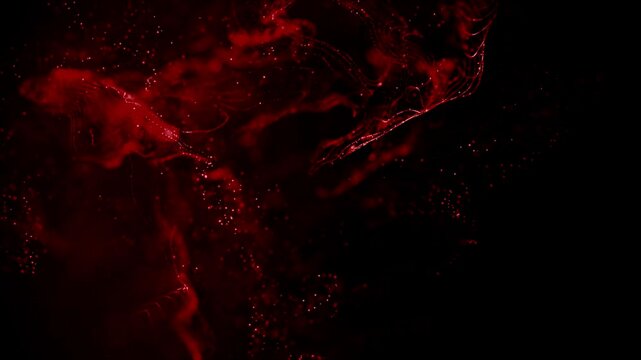 Swirling red crimson blood or other fluid moving and spreading slowly on black background