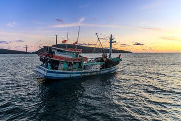 Obraz premium Sunset in the floating fishing village. An Thoi Port, Tropical Phu Quoc Island, Vietnam