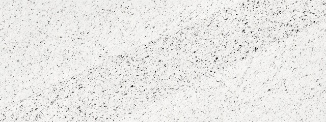 Obraz premium A textured background featuring a subtle pattern of speckles and lines.