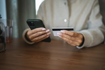 Adult woman use smart phone for online shopping transaction safely