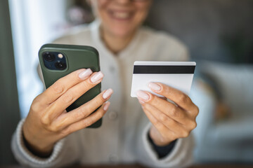 Adult woman use smart phone for online shopping transaction safely