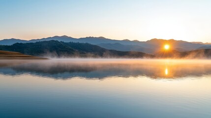 Serene mountain lake at dawn, mist rising from the water, crisp and cool morning air in a peaceful landscape