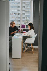 Mom Teaches Daughter at Desk. Home Distance Learning, Schoolgirl Doing Homework at Home