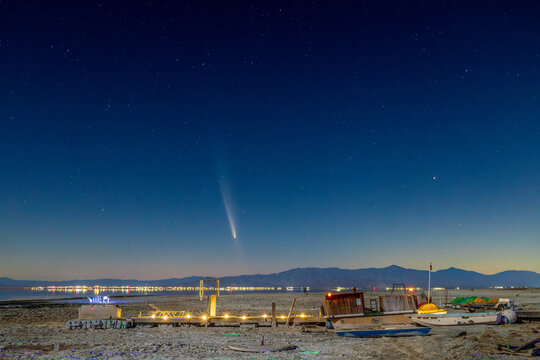 Comet C/2023 A3 (Tsuchinshan&ndash;ATLAS) over a dried out boat dock near the Salton Sea in Bombay Beach, California